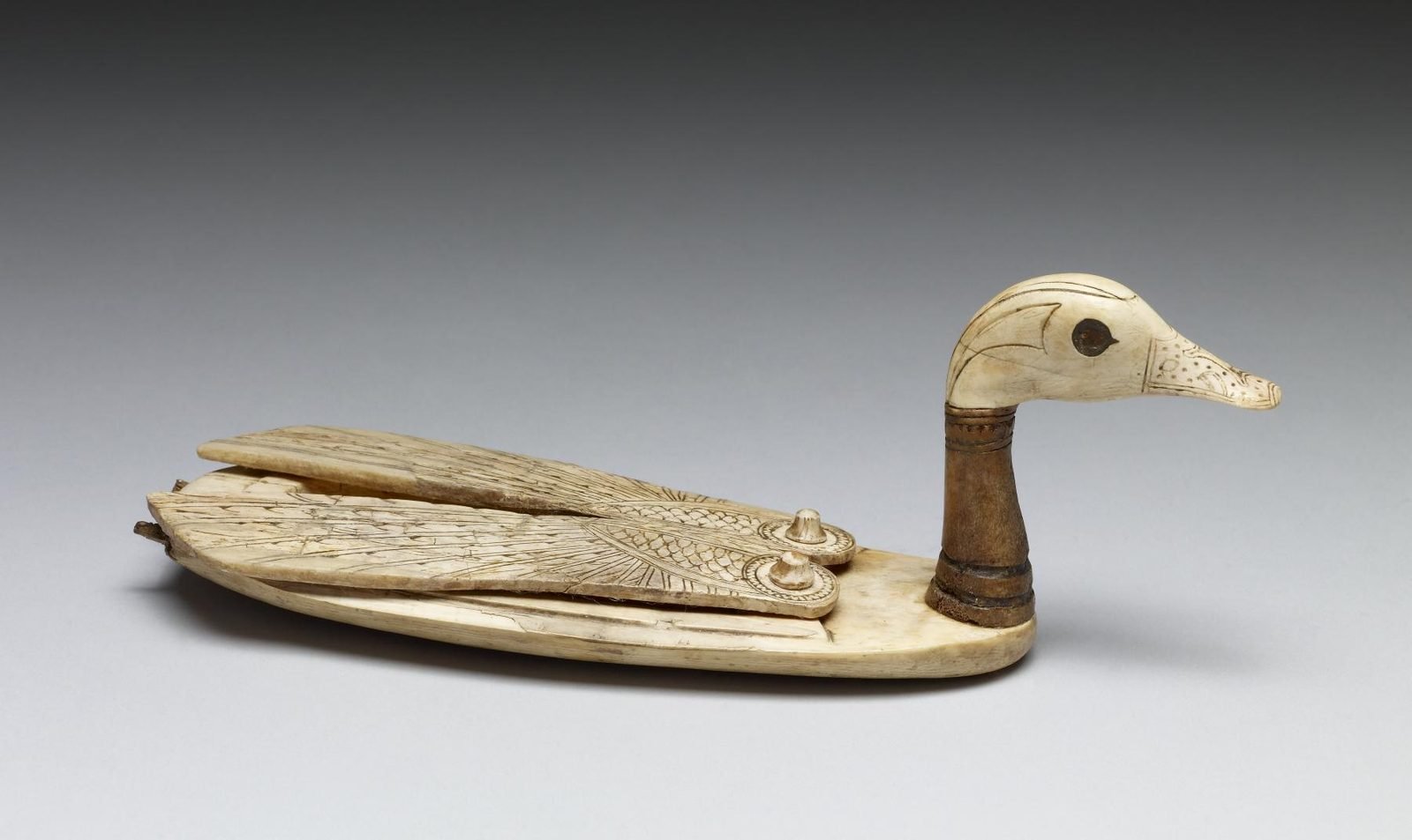 A small Egyptian box carved from ivory in the shape of a swimming duck; the wings lift off to hold cosmetics. The Uluburun cargo held two duck-shaped ivory boxes like this one, along with hippopotamus teeth, elephant tusks, and logs of African blackwood.
